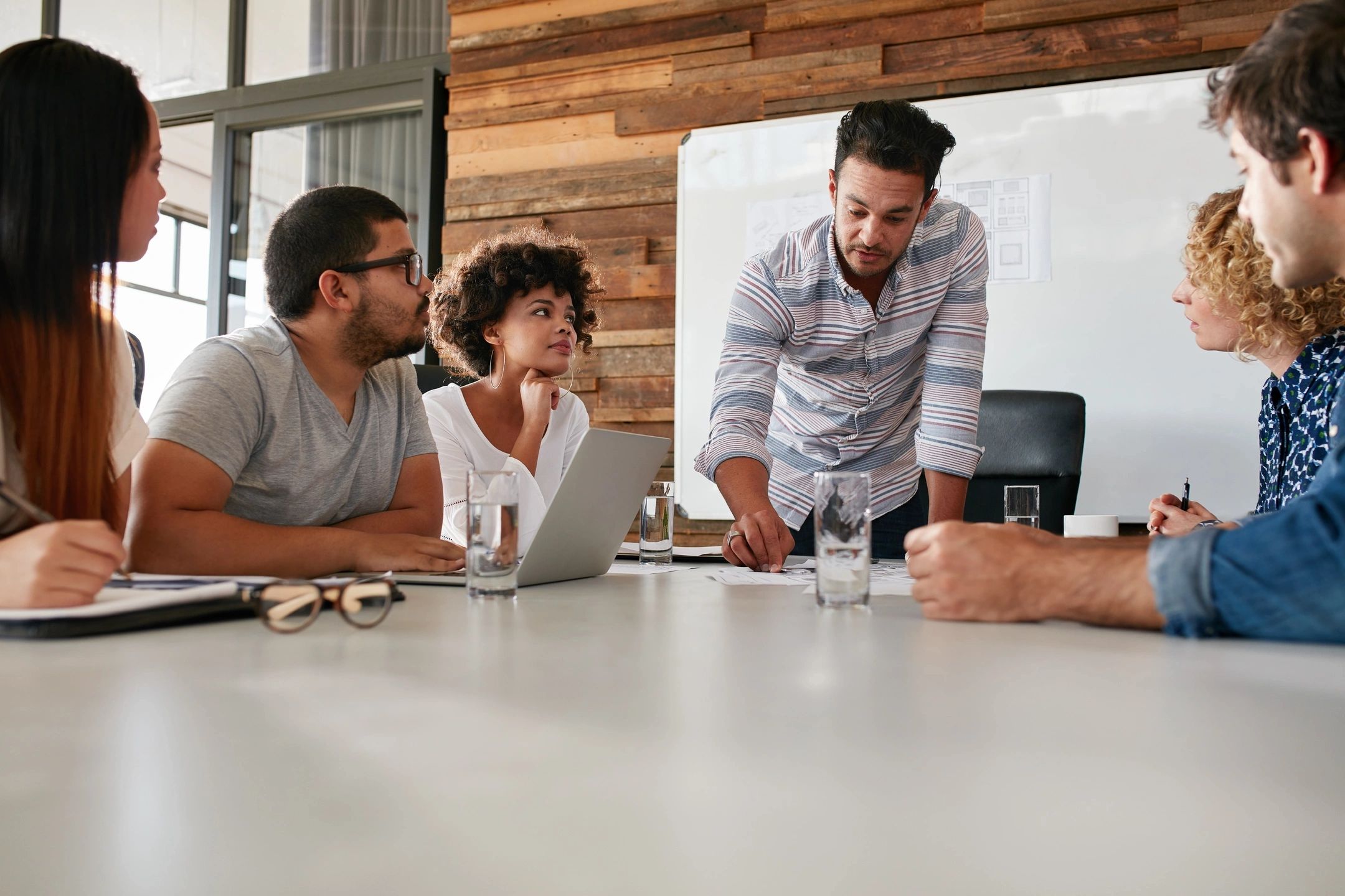 A small business team reviewing financial reports together